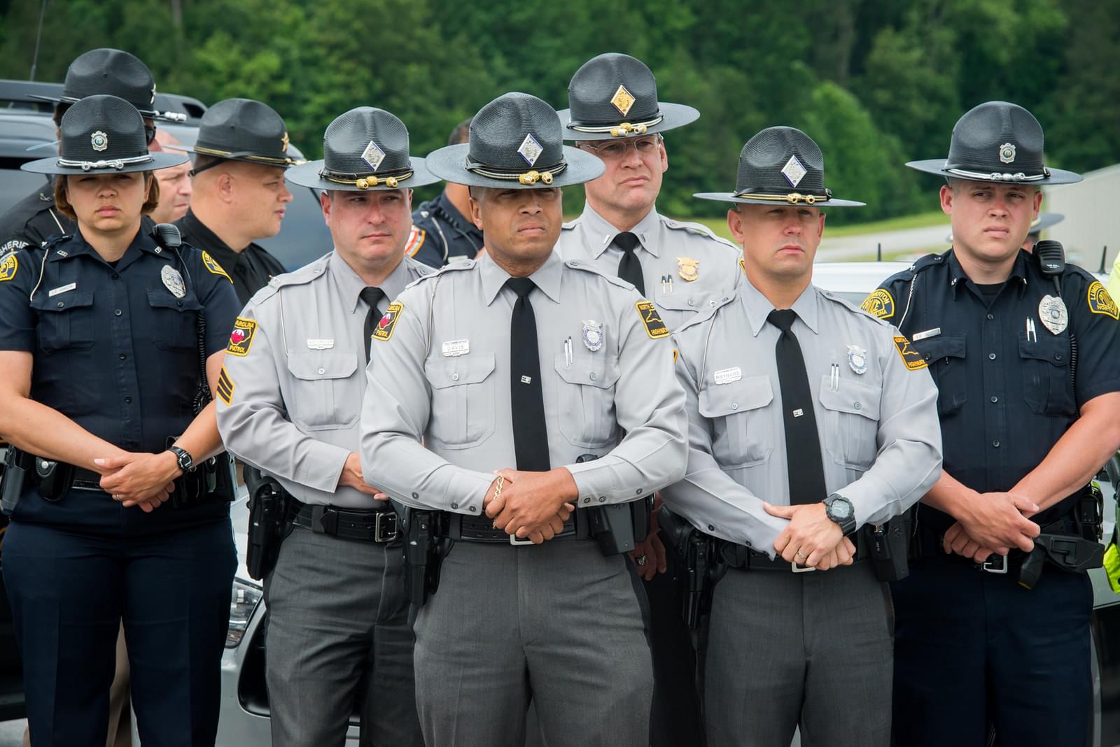 Police officers standing side by side